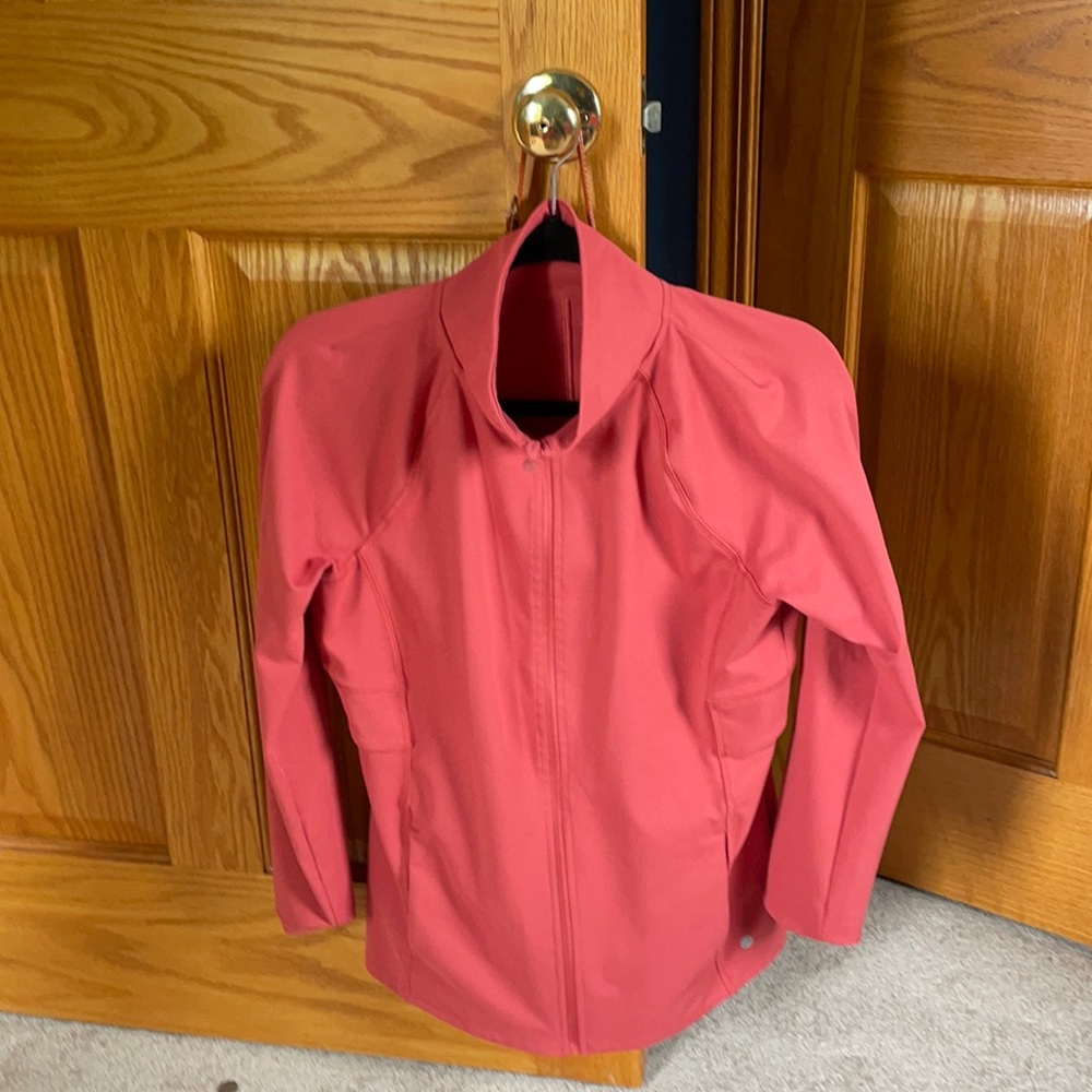 Women’s coral colored zip up jacket